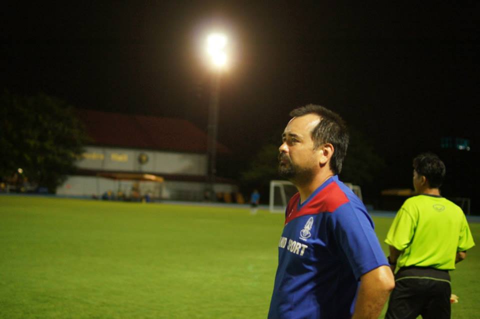 Varsity boys soccer Coach, Justin Wah, watches on during their game against the Thai staff. (Photo by Mr. Bradley)