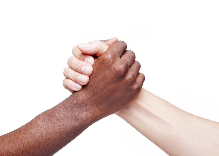 Handshake of friendship and respect, racism concept