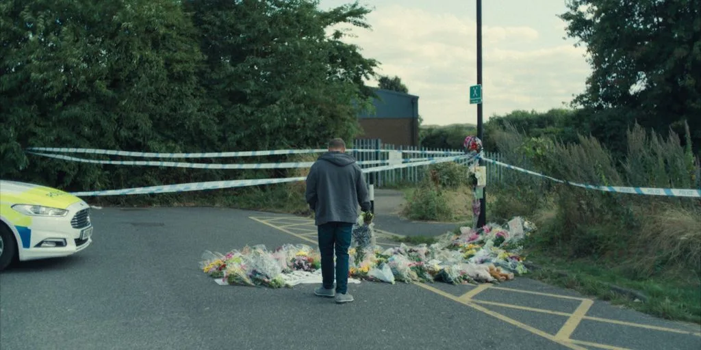 The peaceful yet somber ending shows Mr. Miller visiting Katie’s memorial after Jamie confesses and pleads guilty.