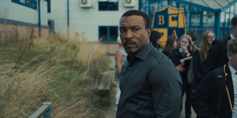 Detective Inspector Luke Bascombe, portrayed by actor Ashley Walters, investigates the murder case.